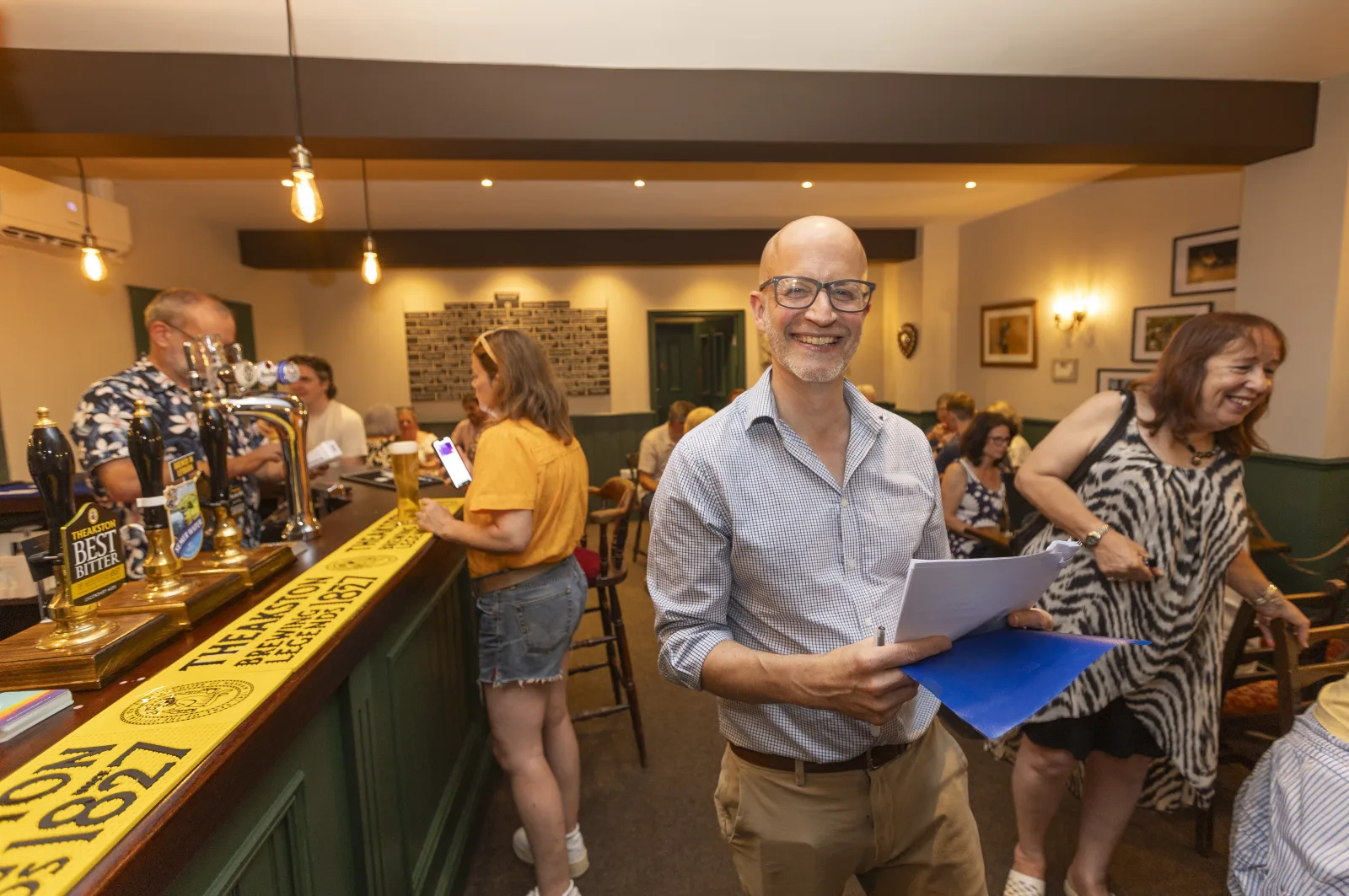 The smiling quiz host welcoming guests at The Black Lion
