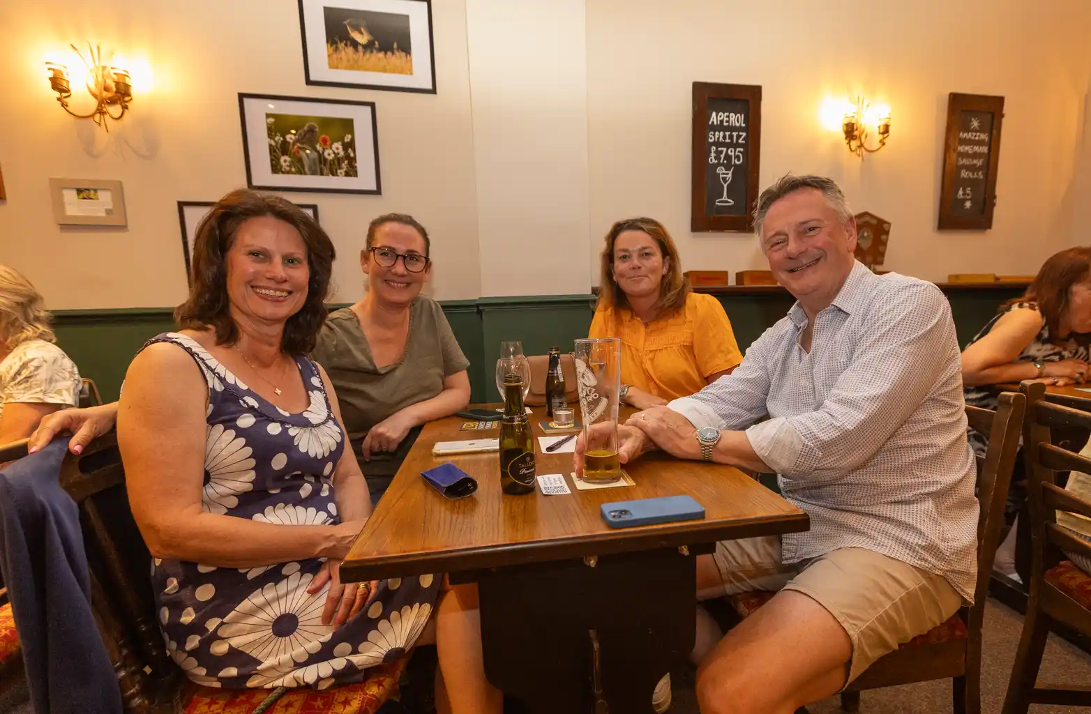 Friends gathered around a table at The Black Lion pub